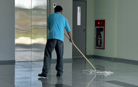 man ceaning with a mop